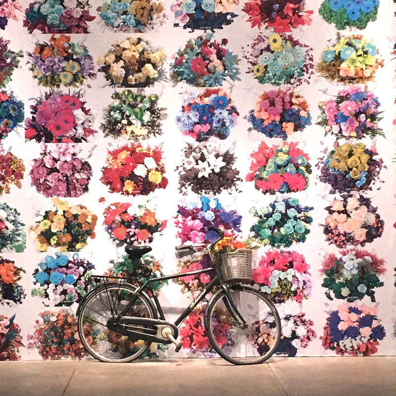 Andy Warhol Museum: A bike in front of a wall covered in flowers